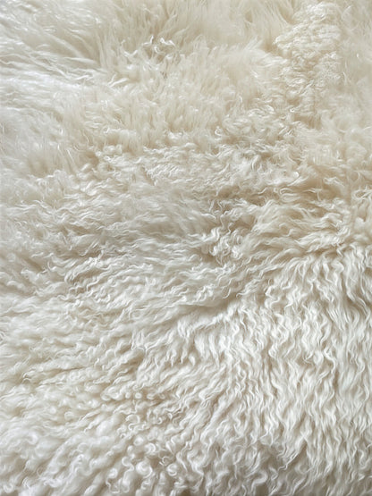 peau de mouton blanche bouclée